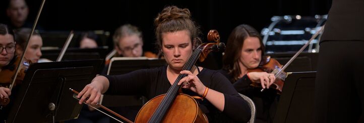 A cellist performing with the Chequamegon Symphony Orchestra